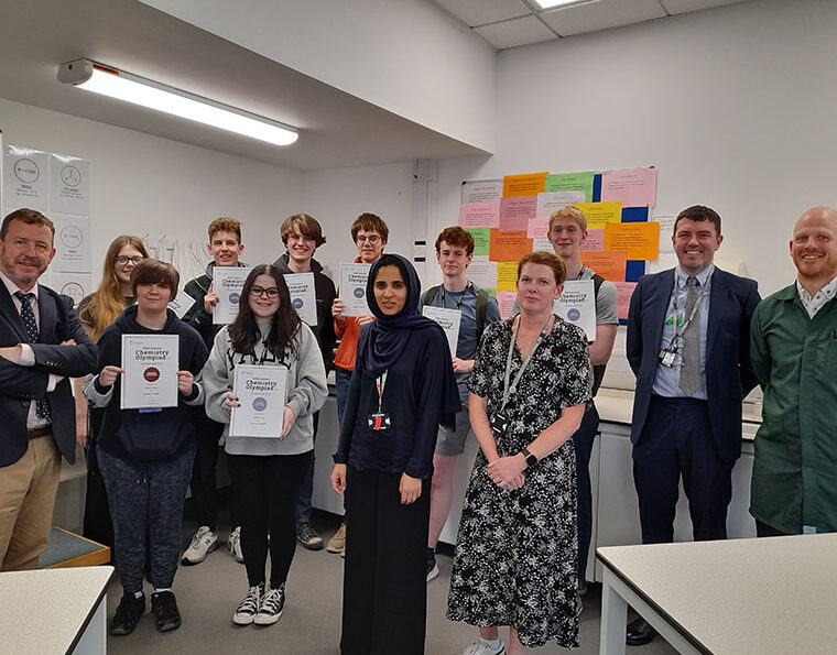 Photograph of students holding their certificates.