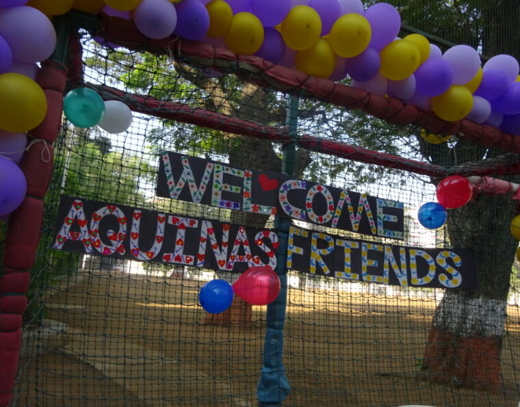 Photograph welcoming Aquinas College to India.