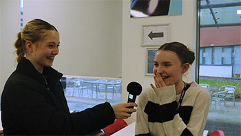 Photograph of Students being interviewed for AQ news