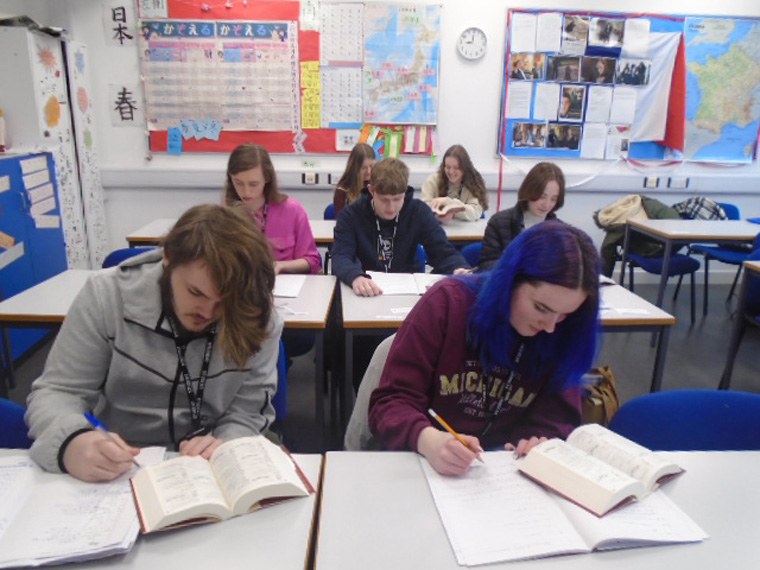 Class of students studying using the Kanji Learner's Dictionary