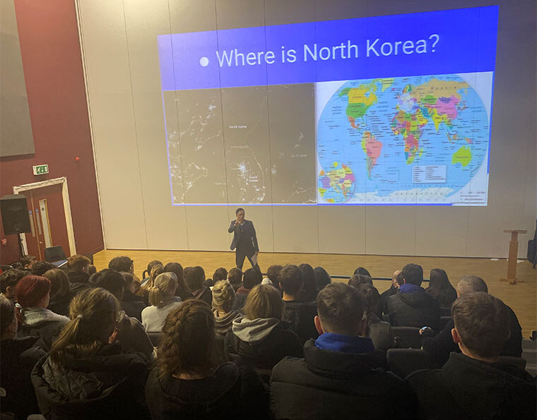 Photograph of North Korean defector Timothy Cho giving a lecture in the theatre.