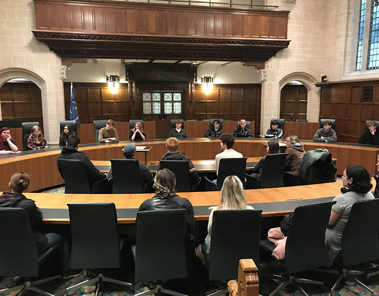 Photograph of students debating in a court room