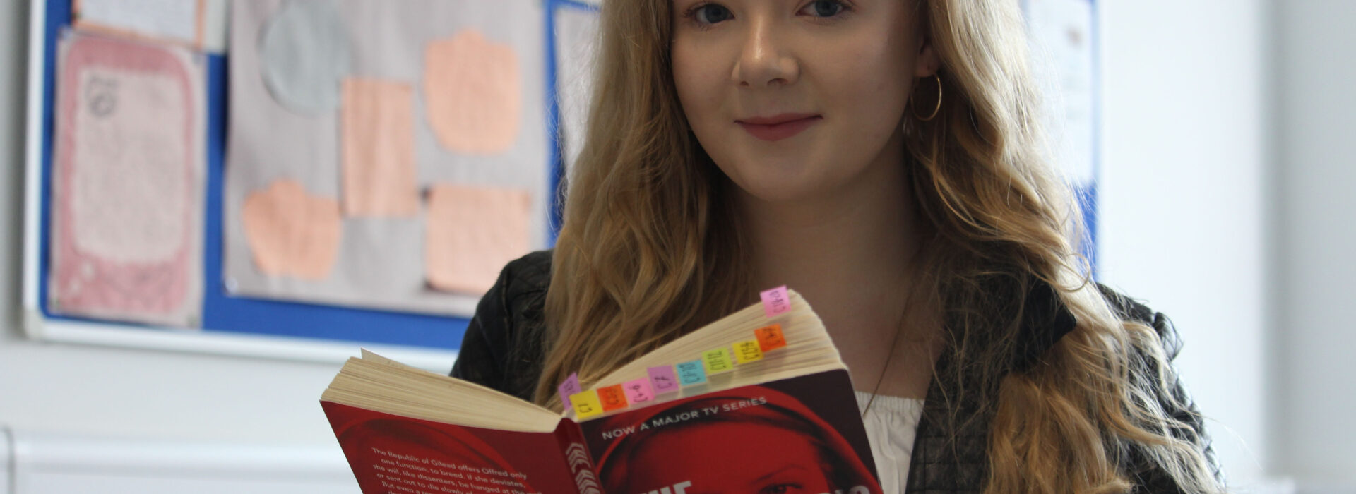 Photograph of a student studying the Handmaid's Tale