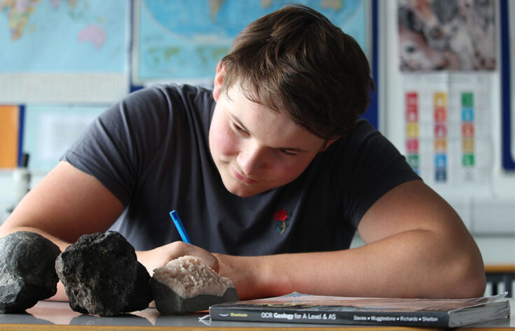 Photograph of a student revising for a Geology exam