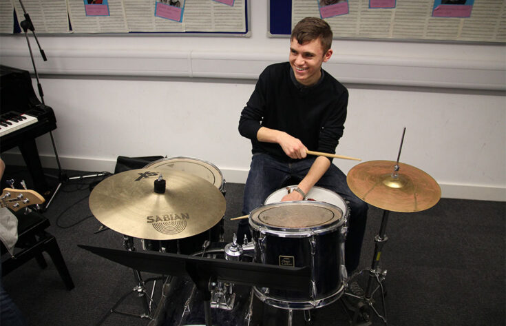 Photograph of a student playing the drums