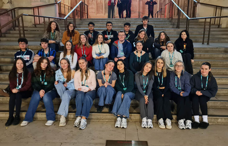 Group photoshop of students sitting on steps