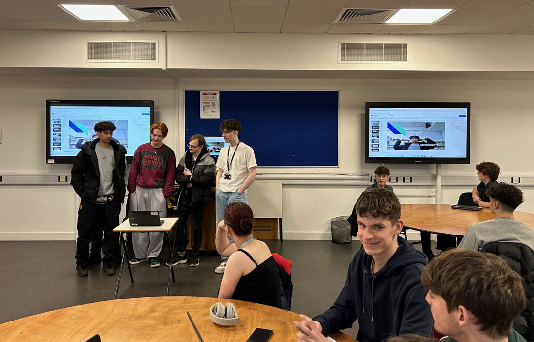 Photograph of students watching a presentation by Fujitsu.