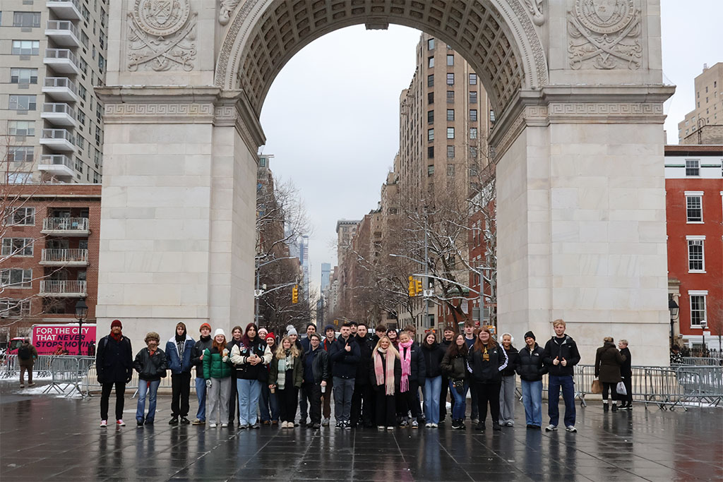 A group of students stood outside Washington Arch in New York.