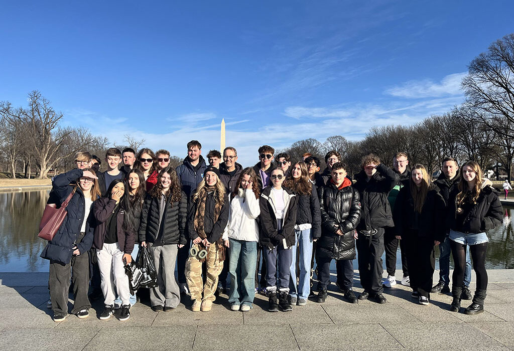 Group of students stood outside a lake in Washington